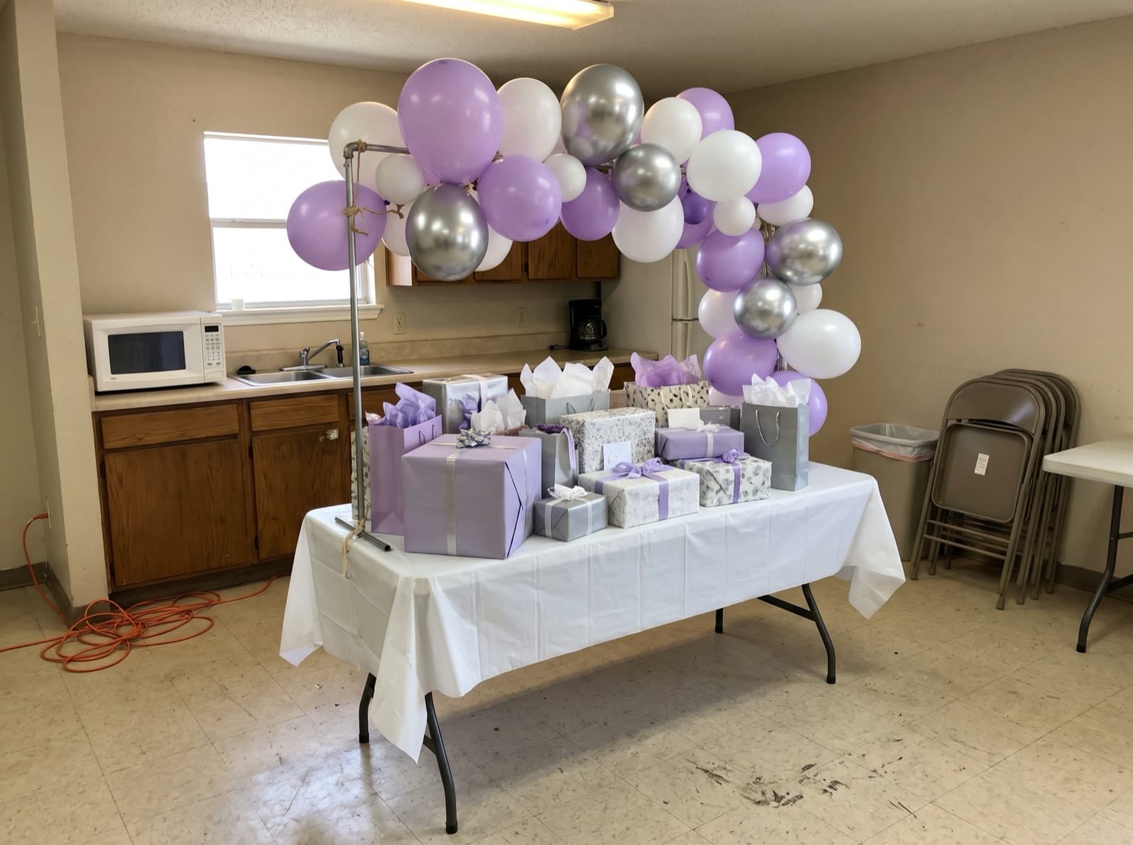 Mini tabletop balloon arch over a gift table